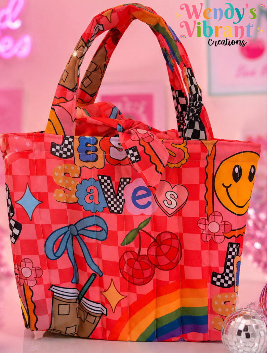 Colorful tote bag with cartoon designs on a pink background